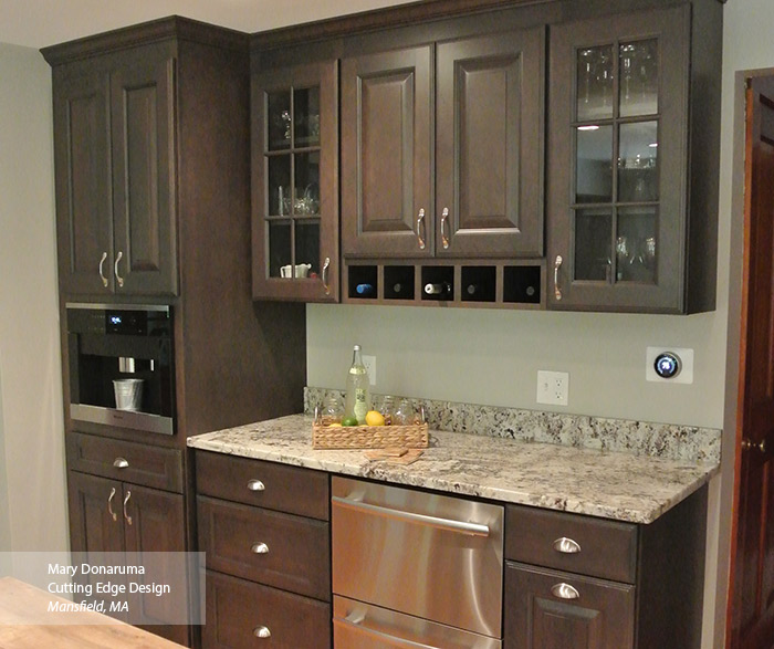 Bar area featuring Maxwell cabinets in Cherry Shadow and glass cabinet doors