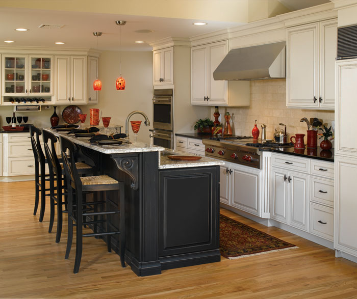 Off white cabinets with black kitchen island by Decora Cabinetry